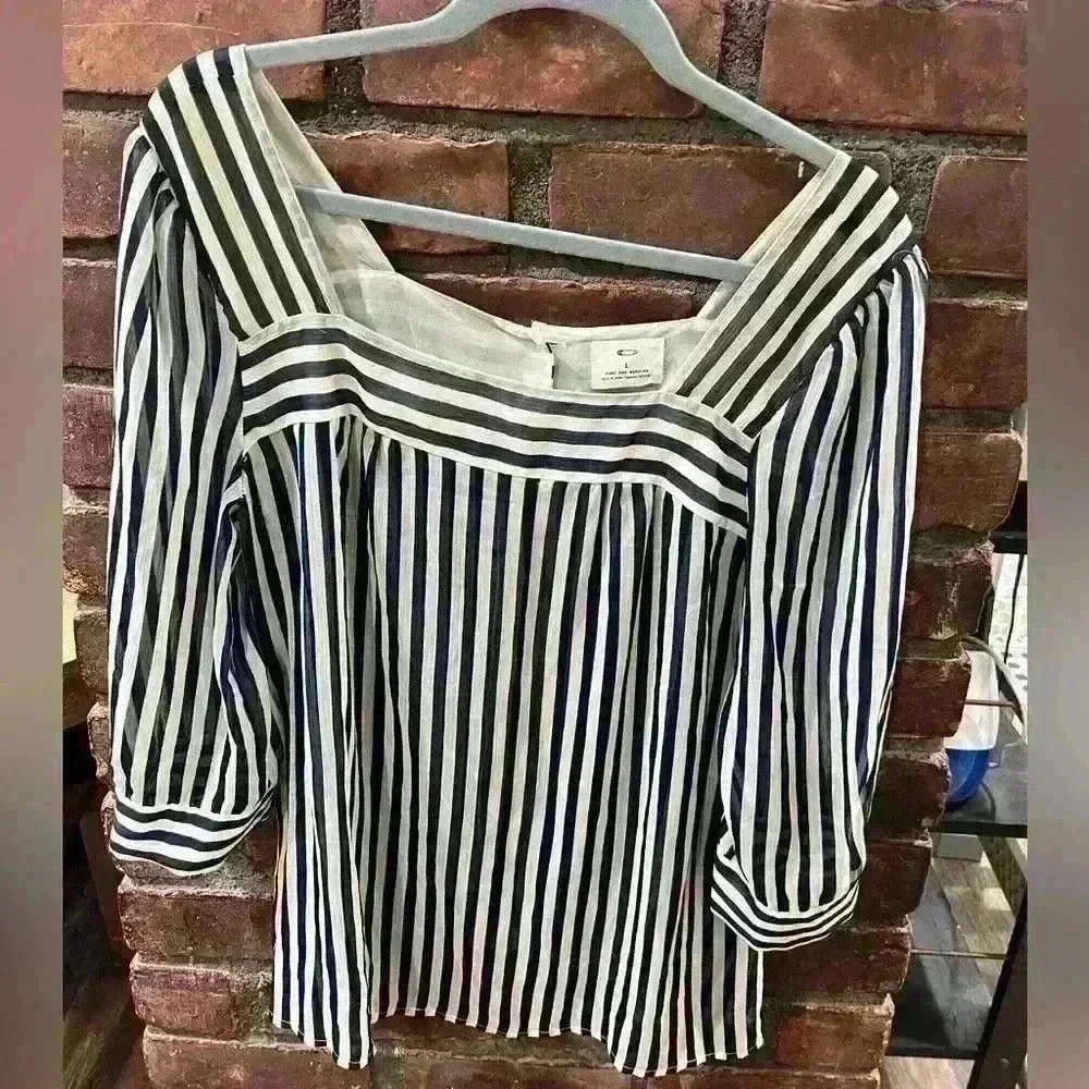 Blue and white blouse with buttons down the back